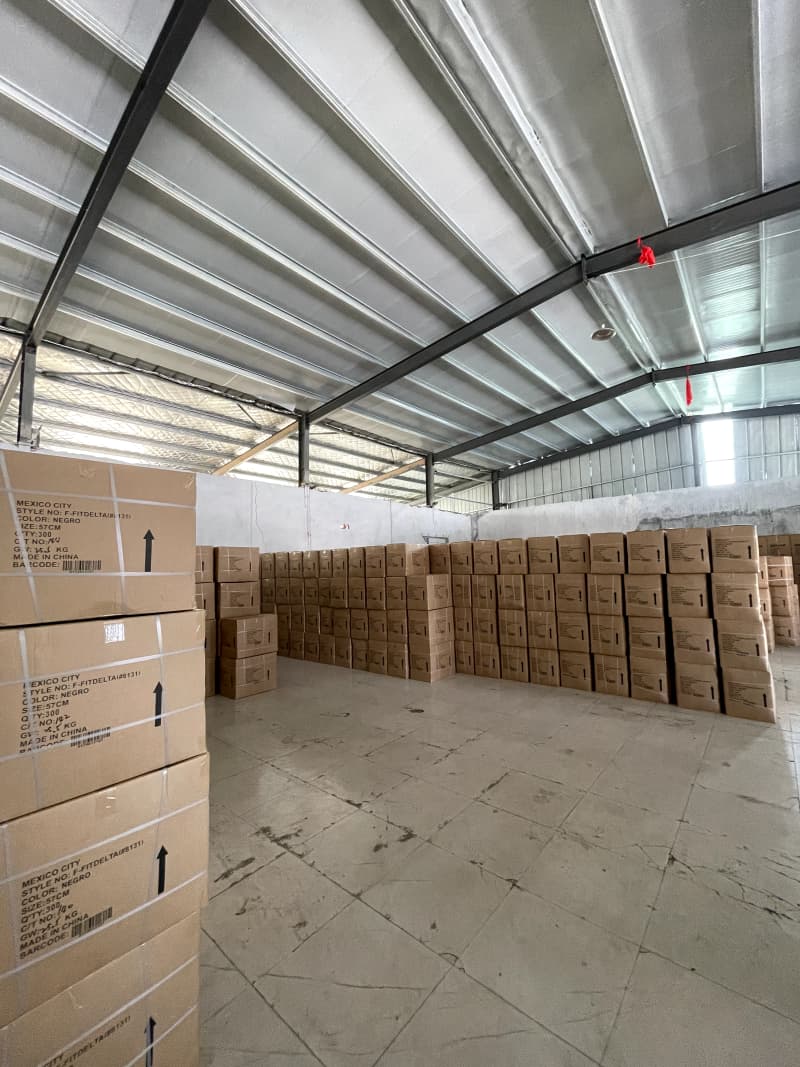 Cartons in the packing and warehouse area at Yuchen Hat Co., Ltd.
